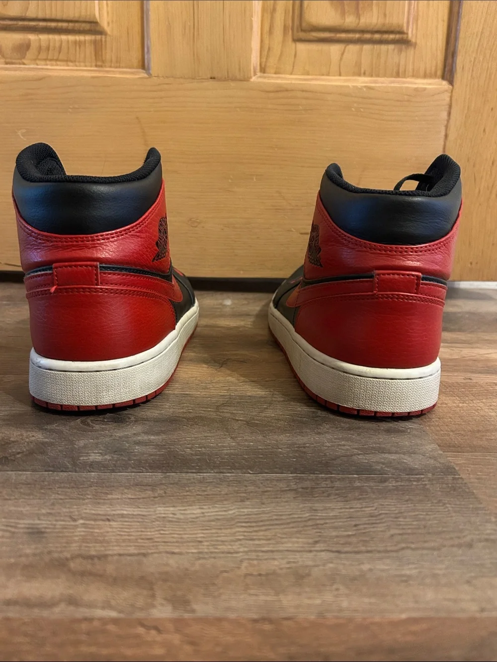 Jordan 1 Retro High Top Sneakers in Black and Red